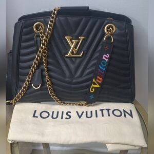Louis Vuitton Black Quilted Shoulder Bag with Gold Accents